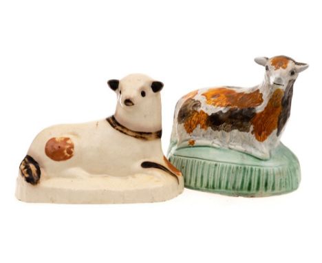 A Bovey Tracey creamware figure of a recumbent lamb and a similar  Prattware figure:  the first decorated with brown and blac