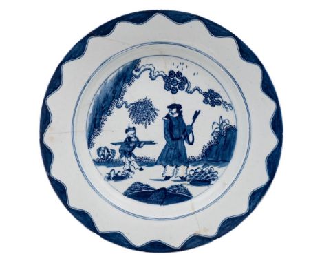 A Bow blue and white 'Golfer and Caddy' pattern plate and a pair of 'lotus and bamboo' octagonal plates: the first painted wi