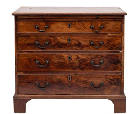 A George III mahogany rectangular chest:, the top with a moulded edge, fitted with a slide and containing four long graduated