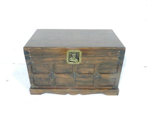 An antique style lockable wooden trunk