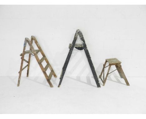 Two vintage wooden stepladders and a stool