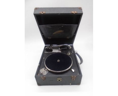A vintage Crescendo portable (made by Decca) gramophone with a selection of records including Elvis Presley, Dean Martin, Bil