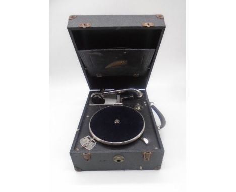 A vintage Crescendo portable (made by Decca) gramophone with a selection of records including Elvis Presley, Dean Martin, Bil