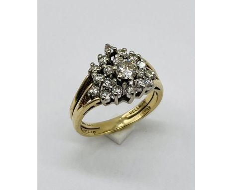 A diamond cluster ring set in 14ct gold