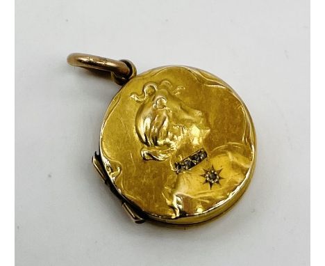 A small 15ct gold locket embossed with a portrait bust of a lady with diamond collar- 1 stone missing 