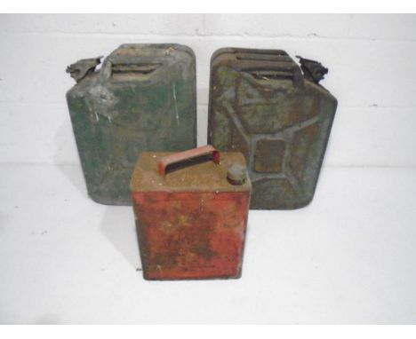 A vintage petrol can, along with two jerry cans