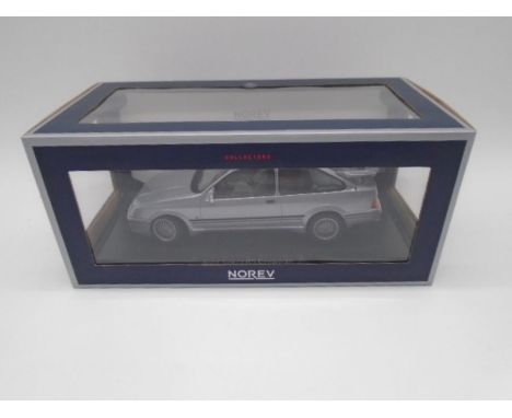 A boxed Norev Collectors Ford Sierra RS Cosworth grey metallic die-cast model car (1:18 Scale)