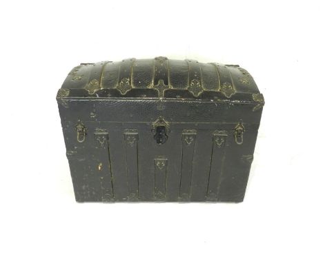 A Victorian dome-topped trunk with metal binding