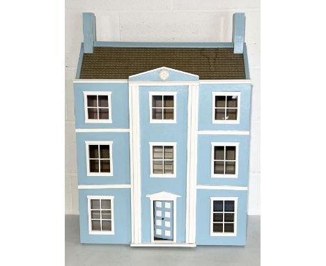 A vintage doll's house styled on a three story Georgian townhouse with a quantity of furniture etc,