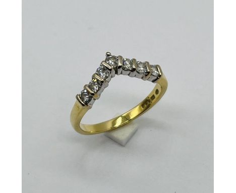 An 18ct gold diamond 7 stone wedding band/ring