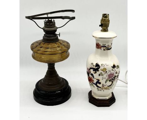 An antique oil lamp A/F along with a Mason's table lamp