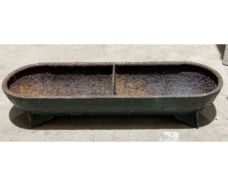 A small cast iron trough