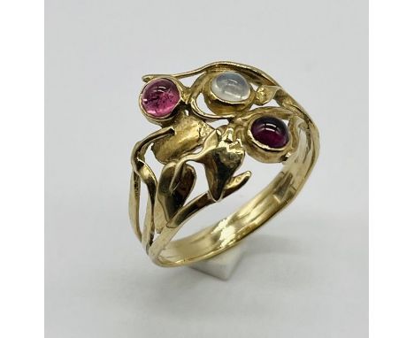 An Art Nouveau style ring set with garnets and moonstone