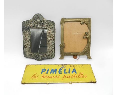 A Japanese copper framed mirror along with a brass Art Nouveau style picture frame and an enamel advertising topper