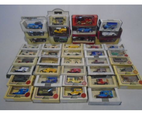 A collection of boxed die-cast vehicles including Matchbox Models of Yesteryear and Lledo Days Gone etc  