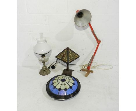 A Tiffany style lamp along with a Victorian oil lamp, an anglepoise workshop lamp and a glass ceiling lamp