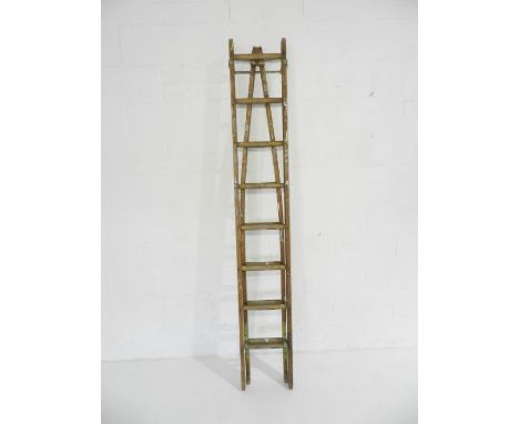 A vintage wooden decorators ladder with tapered end 
