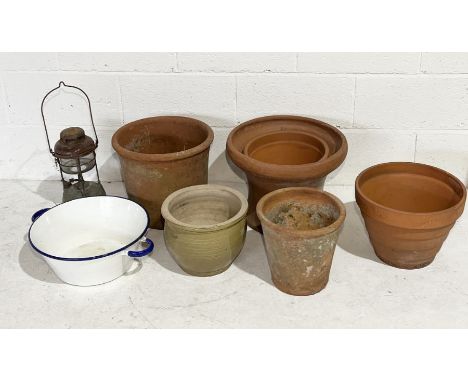 A collection of various terracotta pots, Tilley lamp, enamel bowl etc