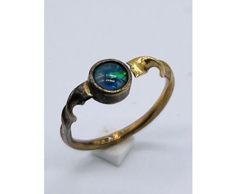 An 18ct gold ring set with an opal  A/F, total weight 2.1g