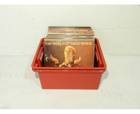 A quantity of 12" vinyl records including David Bowie, Bryan Ferry, Yes, The Rolling Stones, T'Pau, Jimi Hendrix, Bruce Sprin