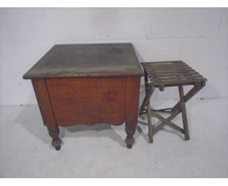 A vintage commode plus a small folding stool.