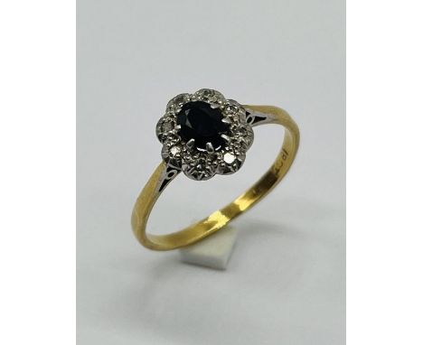 An 18ct gold and platinum diamond and sapphire ring