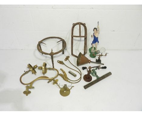 A cast iron trivet along with a bridle rack, gas lamp fittings etc.