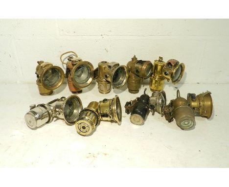 A collection of nine vintage carbide lamps including Lucas, Miller etc.