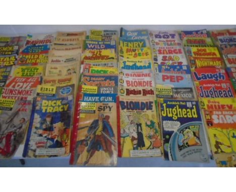 A collection of worn vintage comics, including Blondie, Teenage Love, Classics Illustrated, Wyatt Earp, Rawhide Kid, Mutt &am