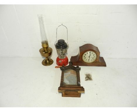 A Tilley lamp along with two mantel clocks (A/F) etc.