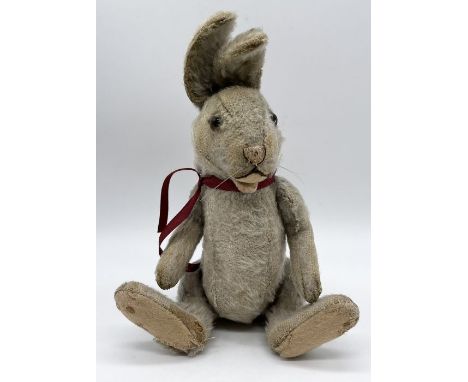A Steiff rabbit with squeaker, mohair fur and silver button to ear