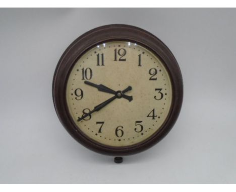 A vintage Bakelite wall hanging clock