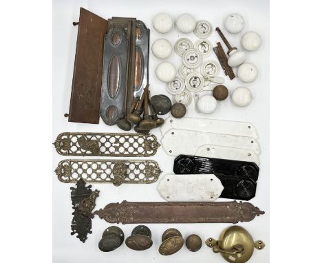 A collection of antique door furniture including lattice door handles, a large finger plate by W&amp;R Leggott Ltd., porcelai
