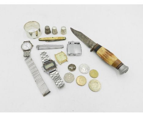 A silver serviette ring along with three silver thimbles, penknives, coins etc. 