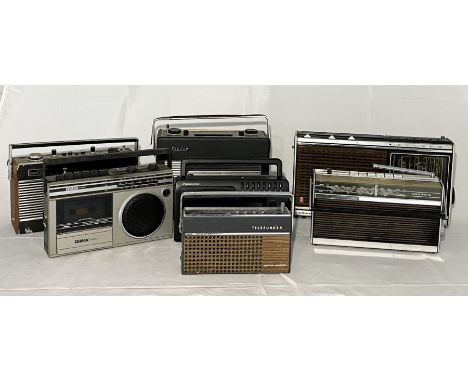 A collection of vintage radios including Hacker, Roberts, Grundig, Omega etc. 