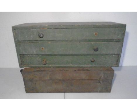A vintage set of industrial wooden drawers and a small wooden trunk/chest