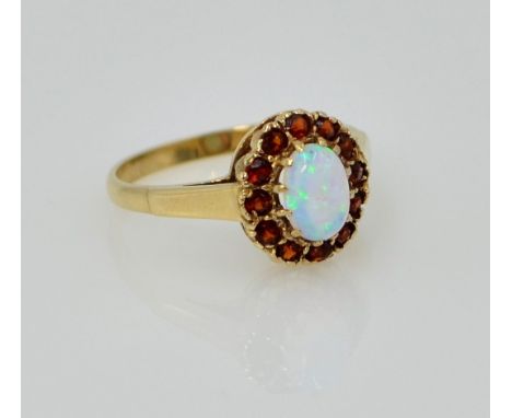 Gold opal and garnet cluster ring hallmarked 9ct   Condition Report  size L-M2.2gm Click here for further images, condition, 