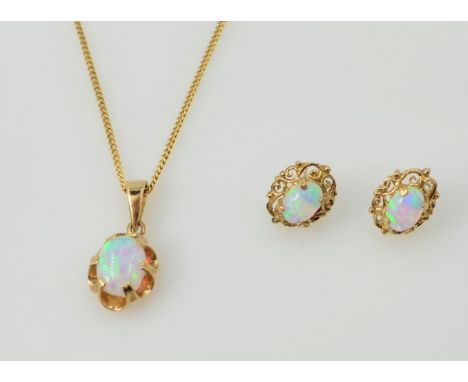 9ct gold opal pendant necklace hallmarked 9ct and a similar pair stud ear-rings    Condition Report  5gm total Click here for