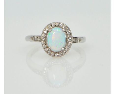 Silver opal halo dress ring stamped 925   Condition Report  size M Click here for further images, condition, auction times & 