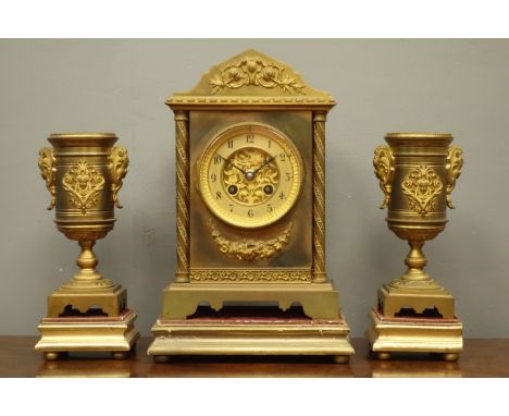 Late 19th century gilt metal architectural clock garniture, stepped pointed arch pediment, foliage twist column pilasters, mo