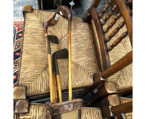 VINTAGE GOLF CLUBS IN A CANVAS AND LEATHER VINTAGE BAG.