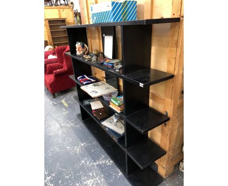 AN EBONISED DISPLAY SHELF.