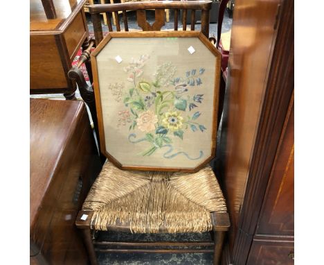 A VINTAGE RUSH SEAT LOW CHAIR AND A NEEDLE POINT PANEL. 