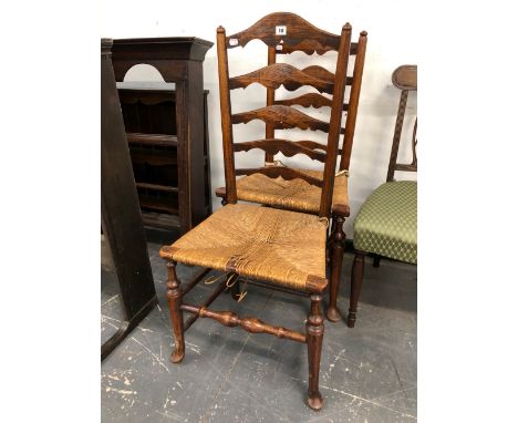 A PAIR OF ARTS AND CRAFTS STYLE, RUSH SEAT LADDER BACK CHAIRS. 