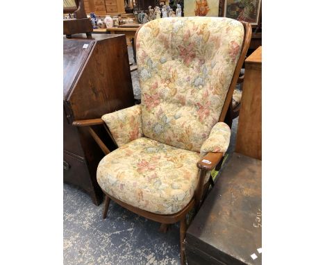 AN ERCOL COTTAGE ARM CHAIR. 