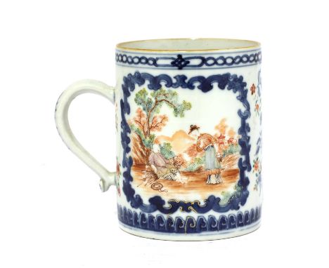 A Chinese famille rose mug, 18th century, painted with figures in a garden in shaped panels, surrounded by sprigs of flowers,