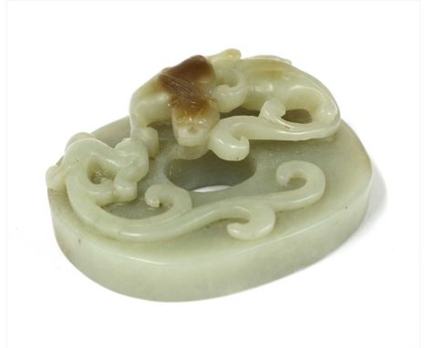A collection of three Chinese carvings, comprising: an hardstone bi disc, decorated with a chilong with lingzhi , the reverse