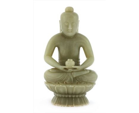 A Chinese jade Buddha, seated cross-legged on a double lotus throne, his overlapping hands resting on his lap holding a jar, 