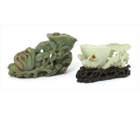 A Chinese jade carving, of bats amongst lingzhi , the stone of greyish-white tone, 14.5cm long, wood stand, and another hards
