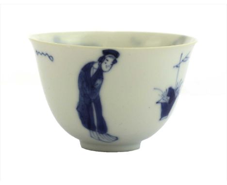 A Chinese blue and white cup, Kangxi (1662-1722), of tapering form on a circular foot, with a flared mouth, painted with ladi
